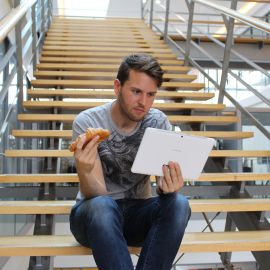 Eating a croissant on the office stairs